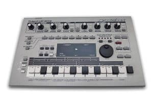 Roland MC-303 Groovebox from 1996, a silver desktop unit with knobs, a 16-step key row and the word groovebox printed on the panel