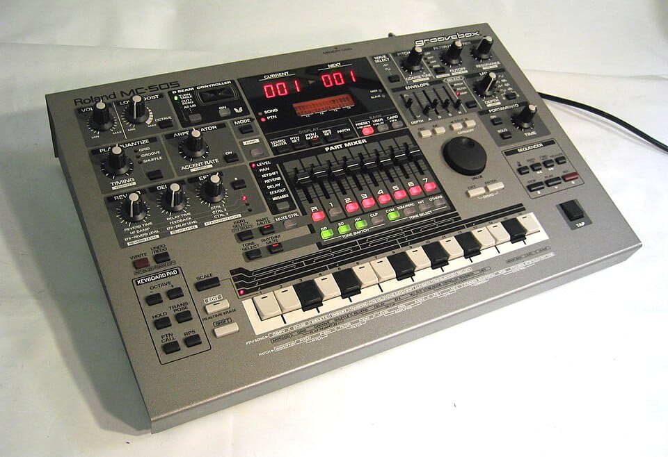 Groovebox 1 Roland MC-505 Groovebox from 1998 with a D-Beam controller, a part mixer with lit buttons and a 16-step key row